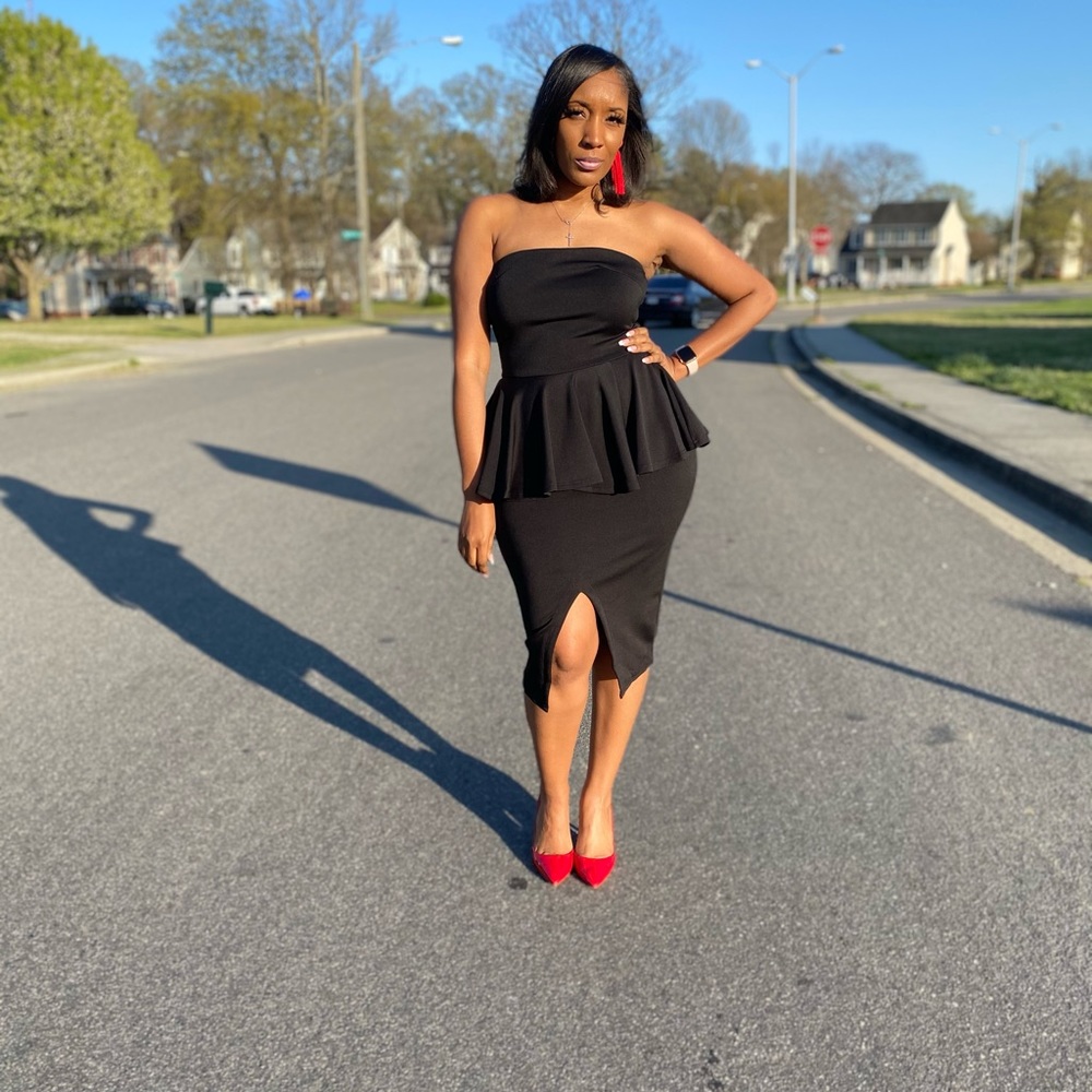 Solid strapless peplum top w/ back zipper closure; pencil skirt with front slit